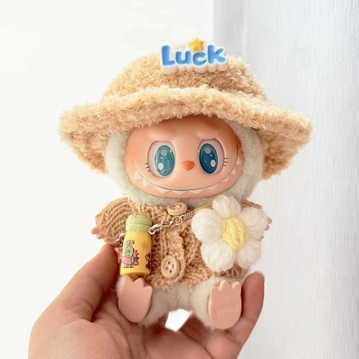 Khaki Button Knit Sweater + Floral Print + Luck Hat + Yellow Water Bottle