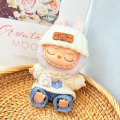 White Flipped-Brim Hat + Kd White Camera + Blue Flipped-Hem Jeans + Blue Six-Petal Floral Sweater