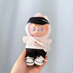 White Hermès Tee + Cuffed Black Pants + White V Bag + White Canvas Sneakers + Black Bubu Hat