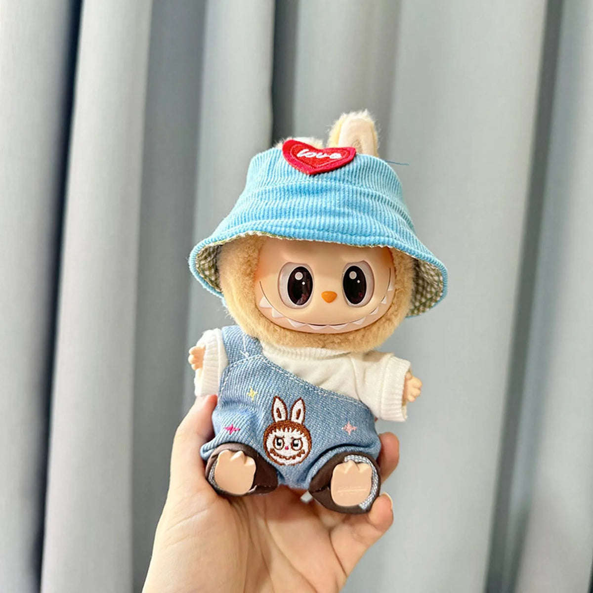 White Tee + Denim Overalls With Ruffled Hem + Blue Heart Hat
